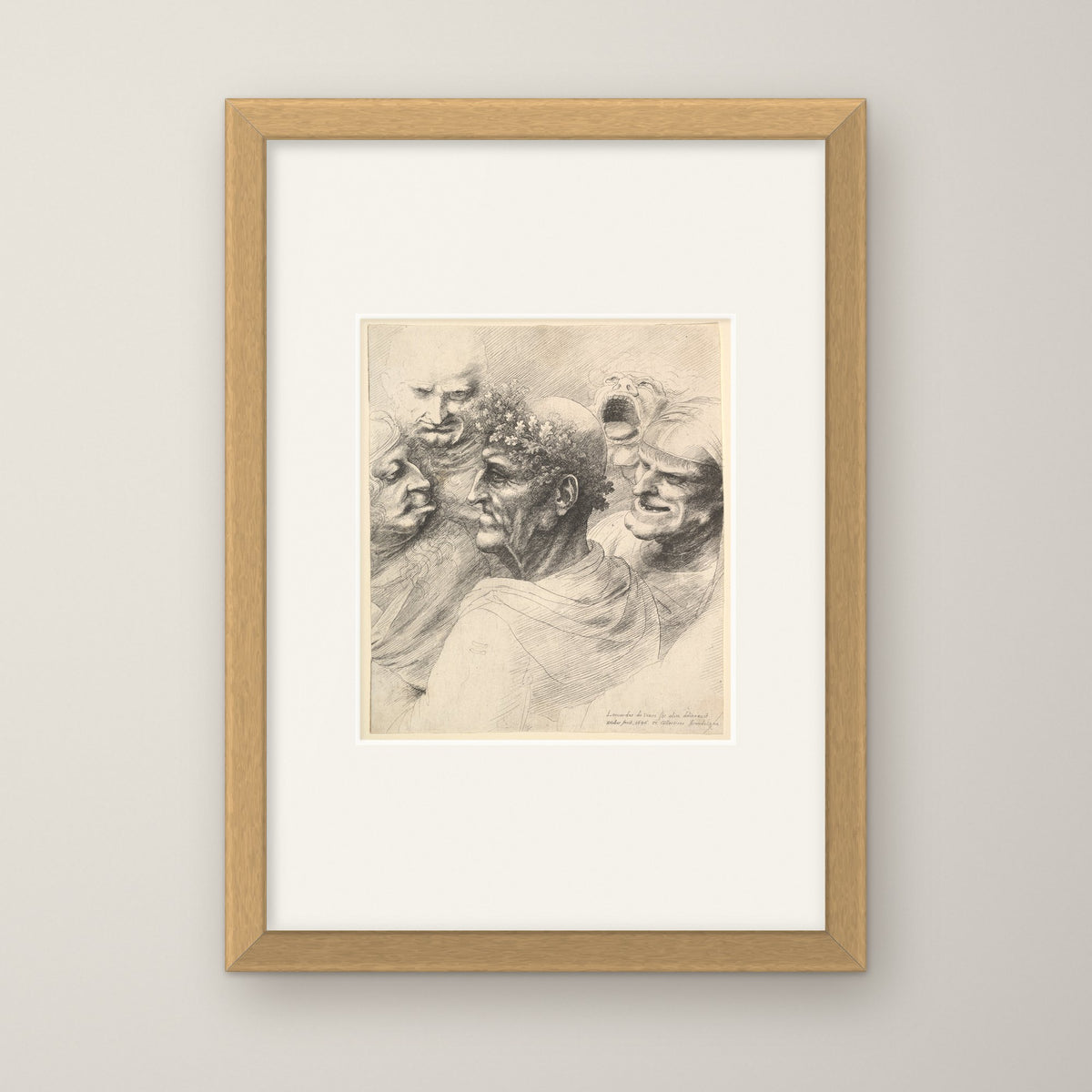Five Grotesque Heads – in an oak frame