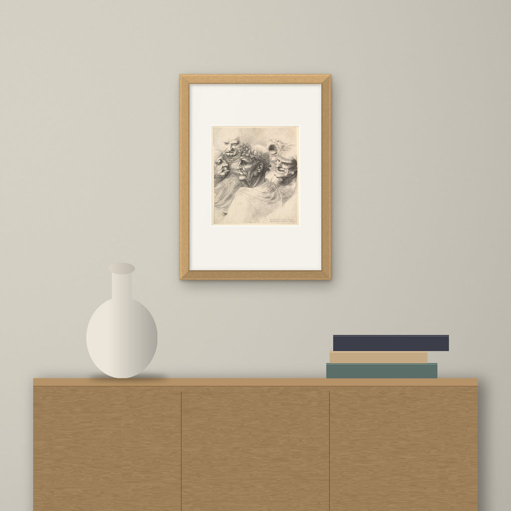 Five Grotesque Heads – framed on a wall above a sideboard