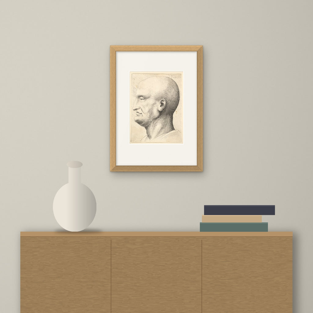 Head of a Bald Man – framed on a wall above a sideboard