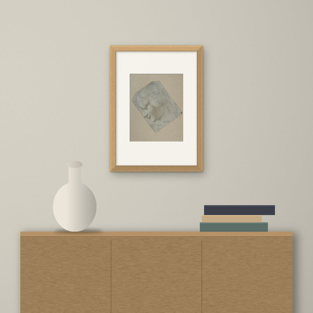 Head of a Woman in Profile – framed on a wall above a sideboard