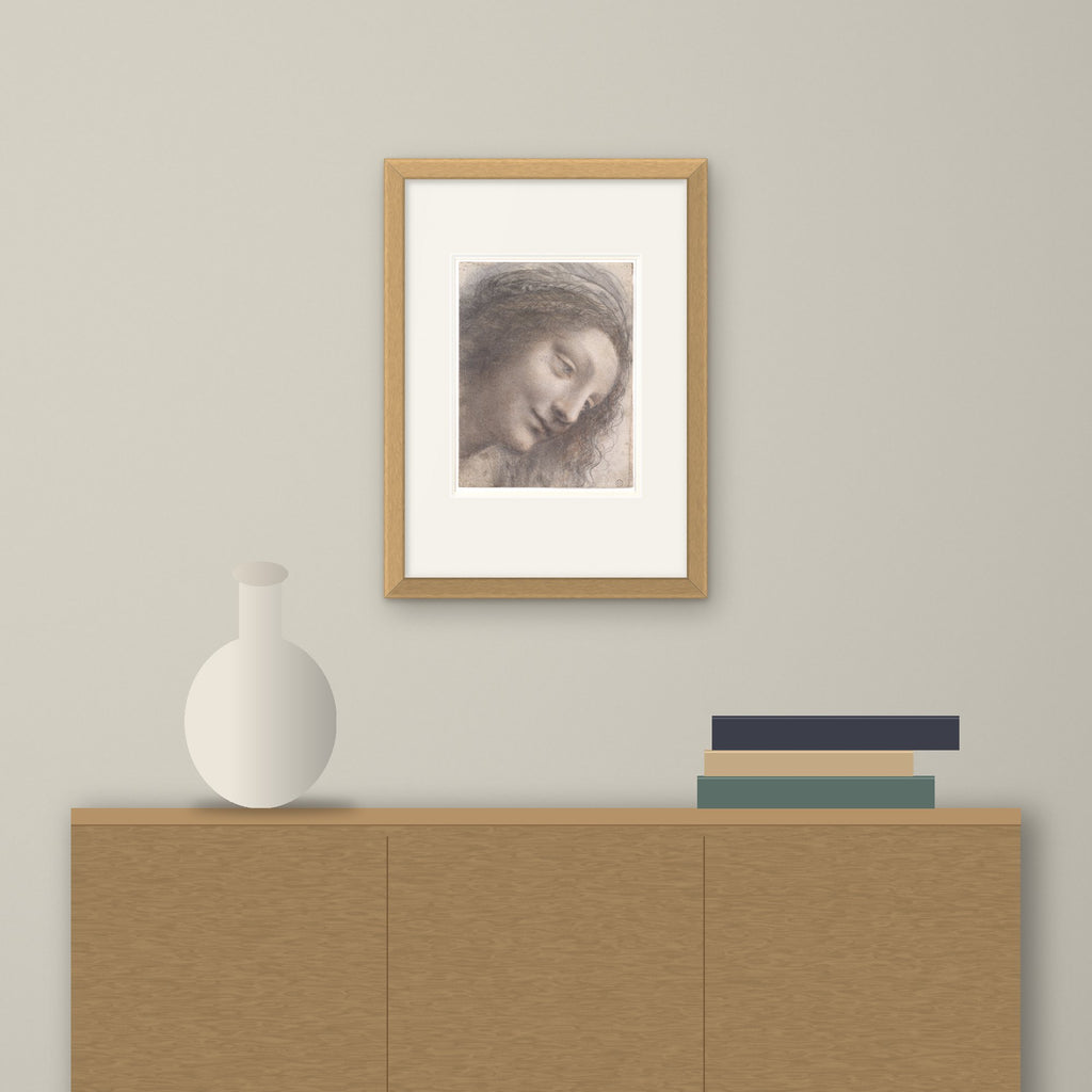 Head of the Virgin – framed on a wall above a sideboard