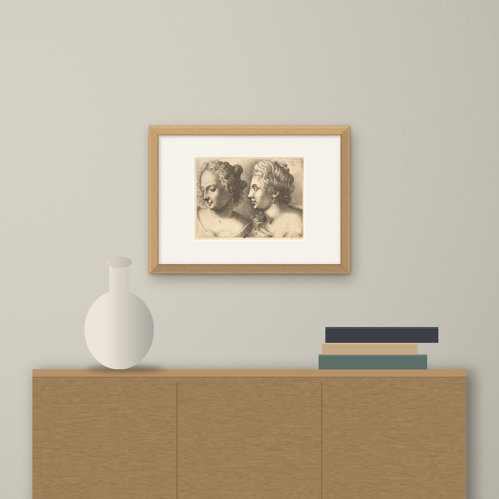 Heads of Two Young Women – framed on a wall above a sideboard