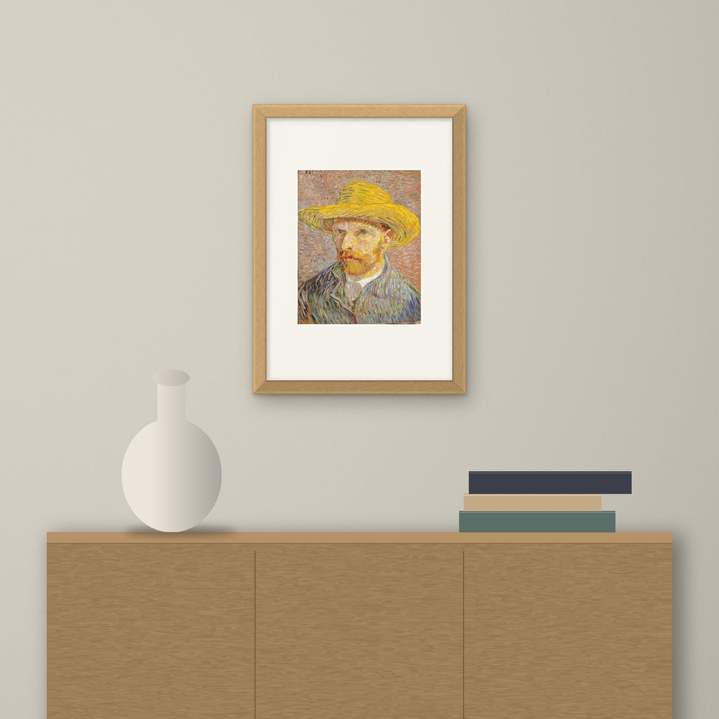 Self-Portrait with a Straw Hat – framed on a wall above a sideboard