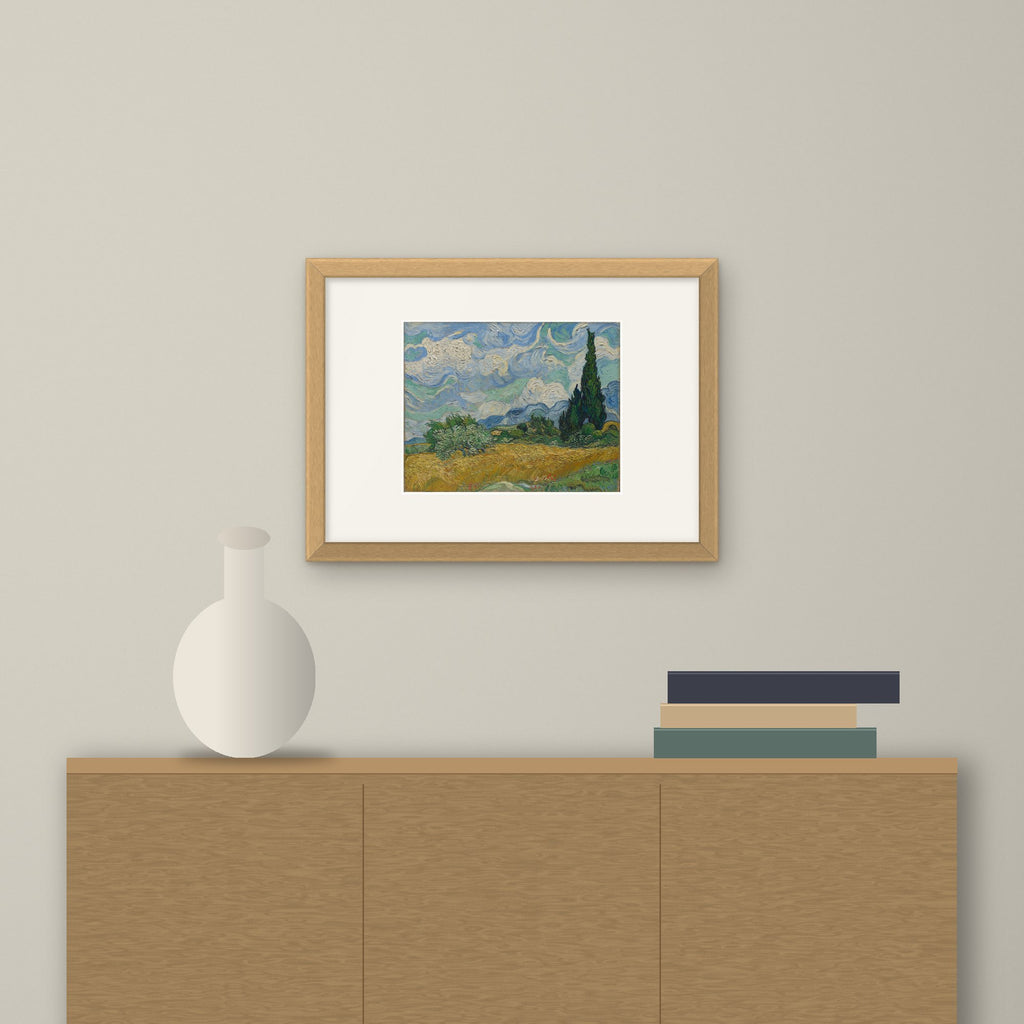 Wheat Field with Cypresses – framed on a wall above a sideboard